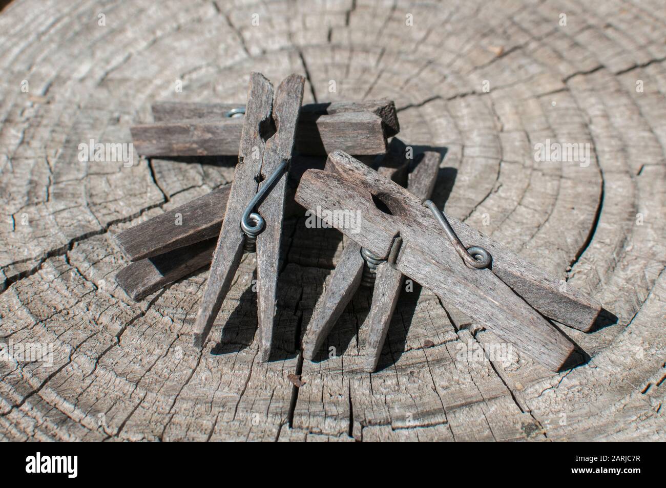 Pile of weathered wooden laundry clamps closeup Stock Photo