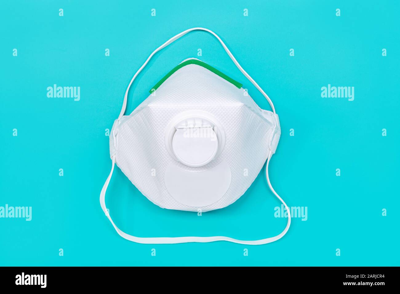 Safety mask isolated on green background. Virus or pollution protection concept Stock Photo