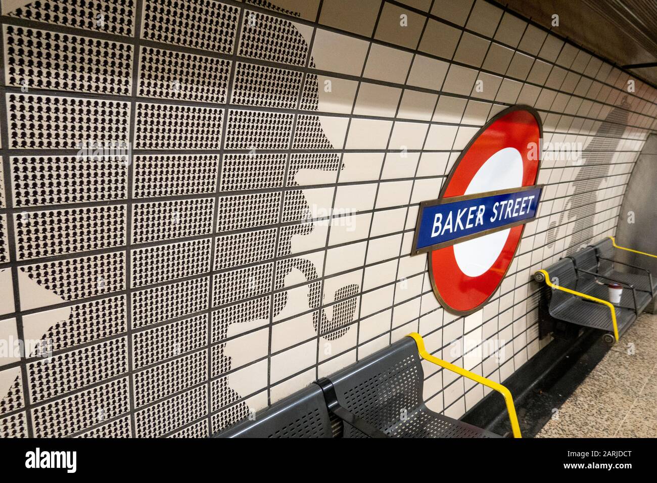 Baker Street Underground platform sign, with Sherlock Holmes Artwork Stock Photo