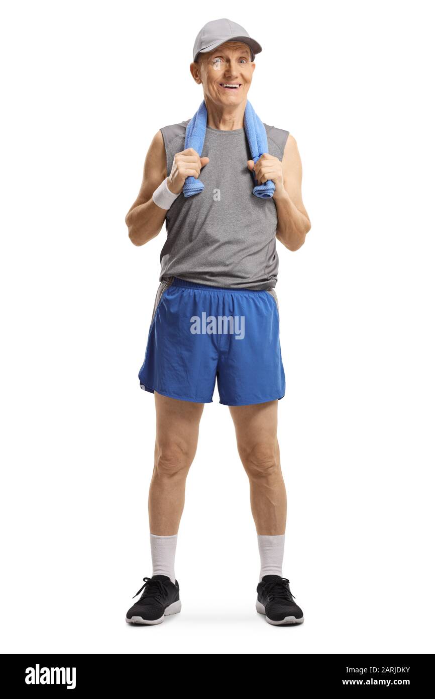 Full length portrait of an active elderly man in sportswear with a towel aroung neck isolated on white background Stock Photo