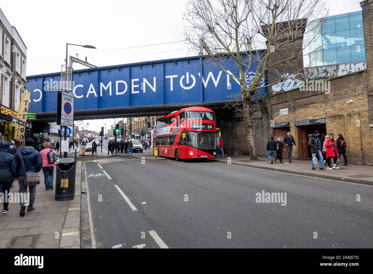 London Bus passes under Camden Town bridge, London, UK Stock Photo Alamy