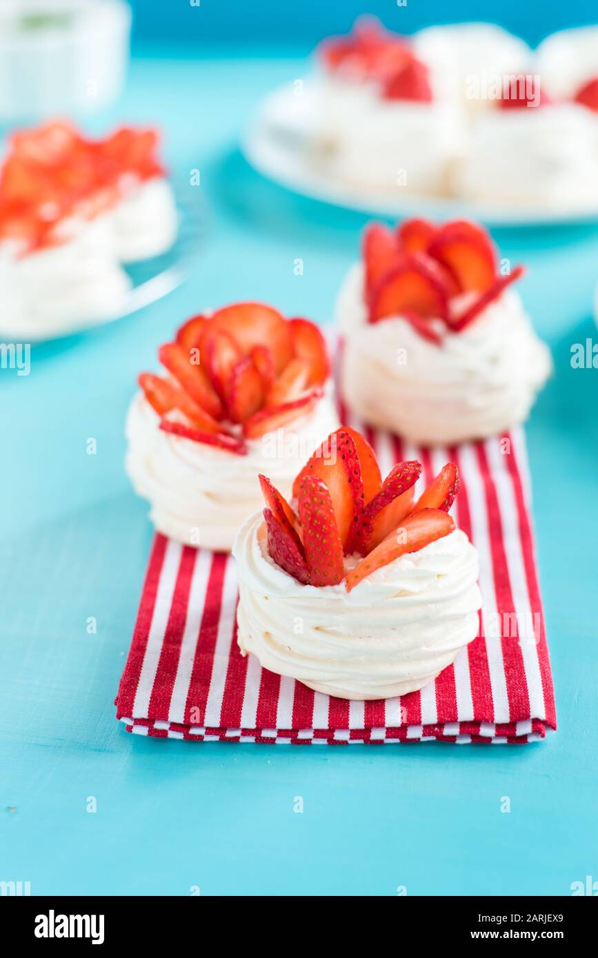 meringue nests with strawberry cream and fresh strawberries Stock Photo