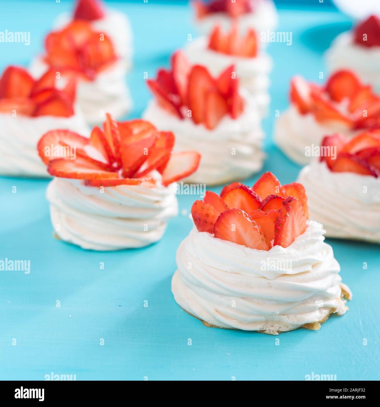 meringue nests with strawberry cream and fresh strawberries Stock Photo