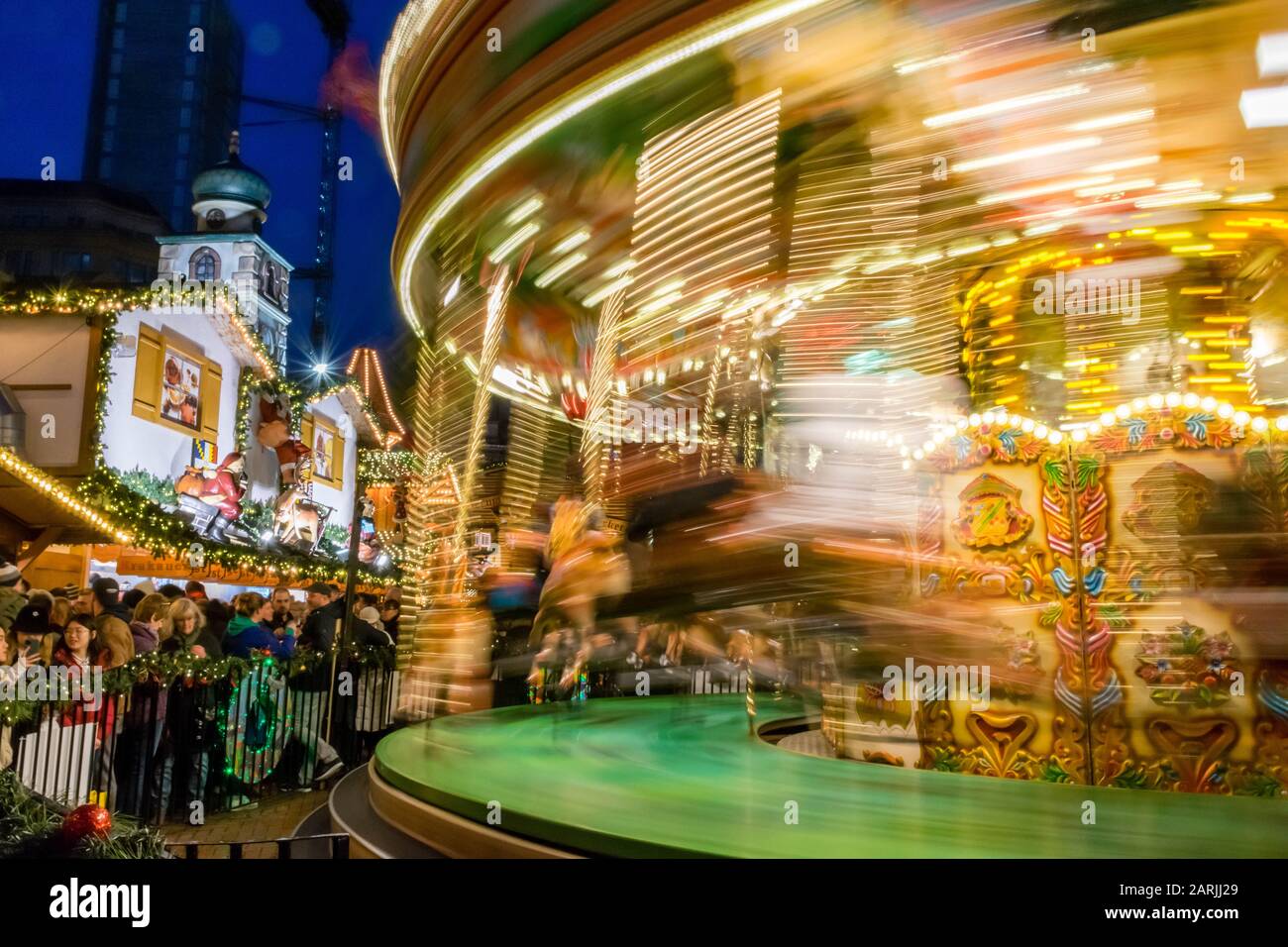 Christmas carouselle in motion at christmas market at Birmingham, UK ...