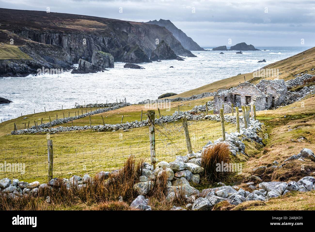 The ruins of an old famine stone built cottage on a remote part of the Irelands west coast in County Donegal Stock Photo