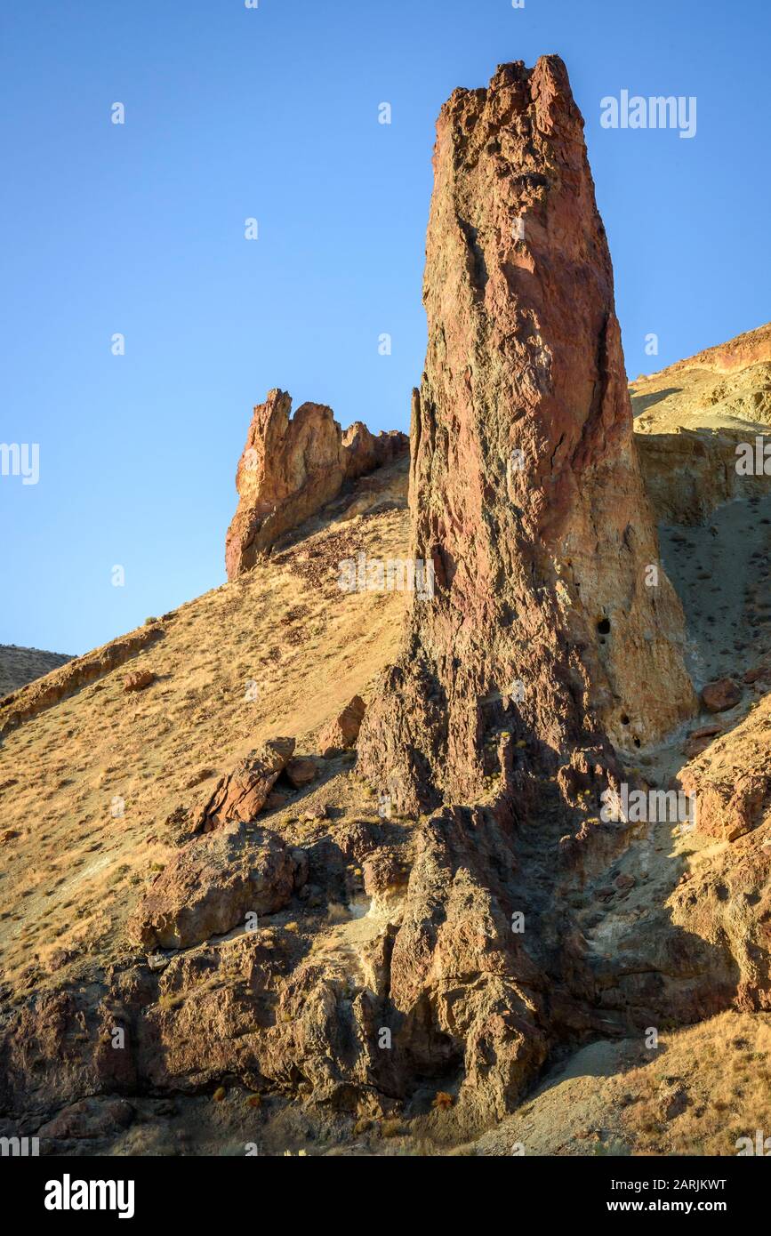 Rock formations of volcanic rhyolite ash-flow tuff showing differential erosion in Leslie Gulch, southeast Oregon. Stock Photo
