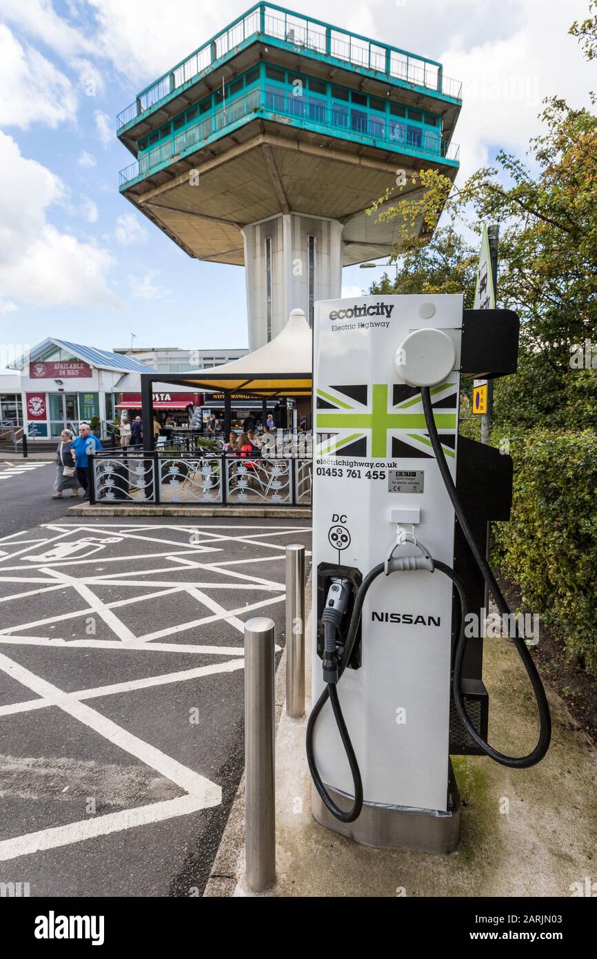 Electric charging point for cars in motorway service area, England, UK Stock Photo