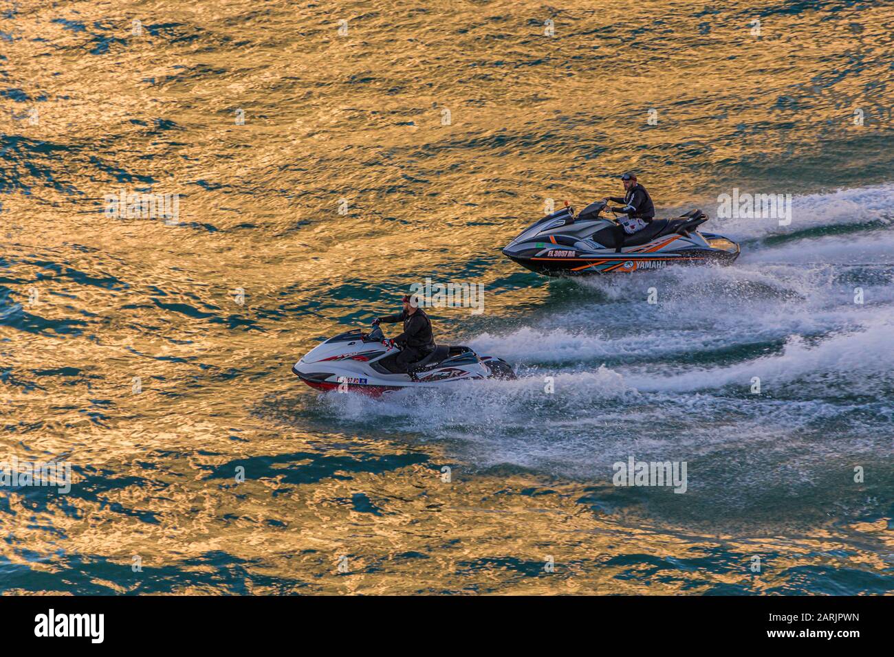 Jet Skis Into Afternoon Light Stock Photo Alamy
