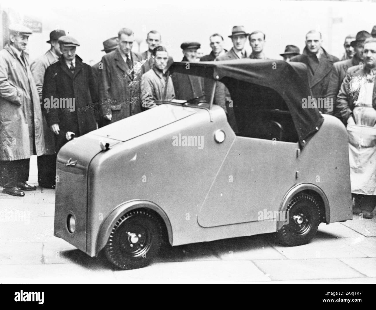 Microcar Convertible Driving a microcar Black and White Stock Photos & Images - Alamy