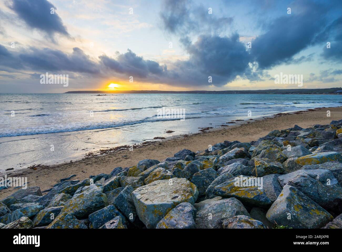 Winters sunset along the beach at Marazion Cornwall England UK Europe Stock Photo