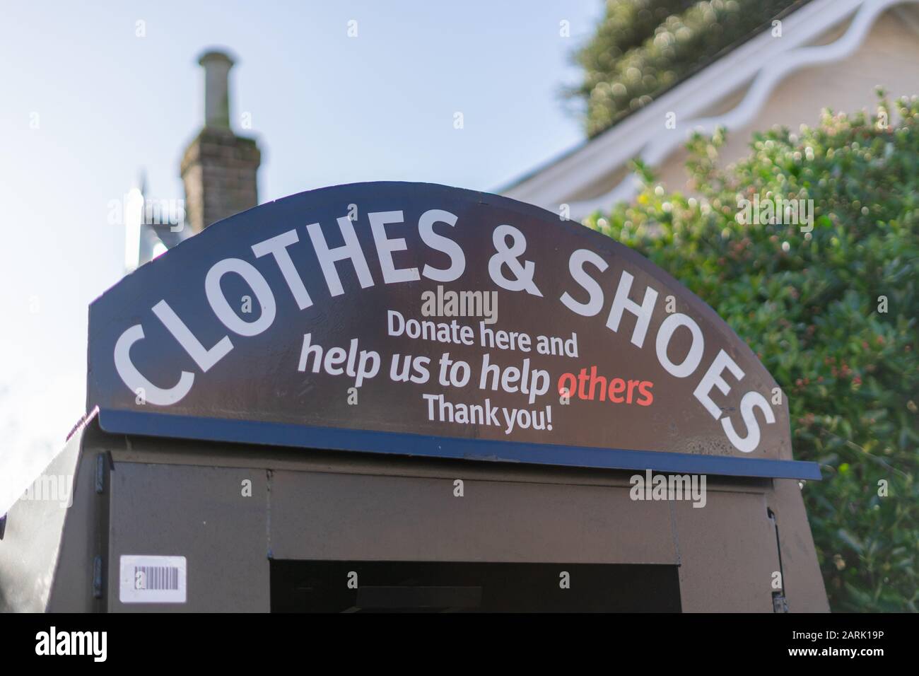 A charity clothes and shoes donation box Stock Photo