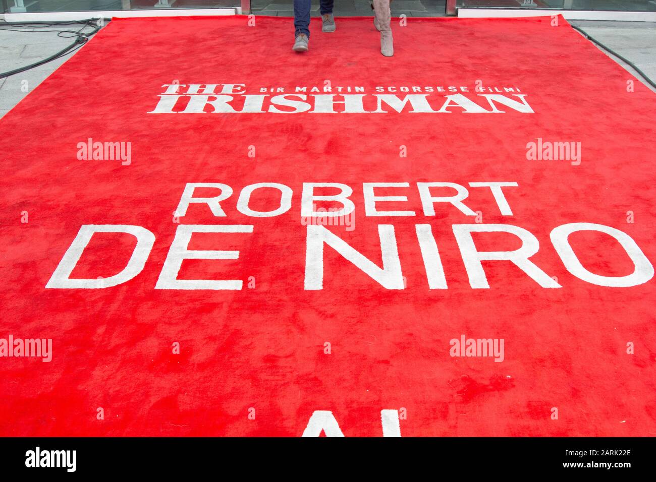Logo of the movie of The Irishman and name of Robert De Niro on red carpet in Netflix event. Stock Photo