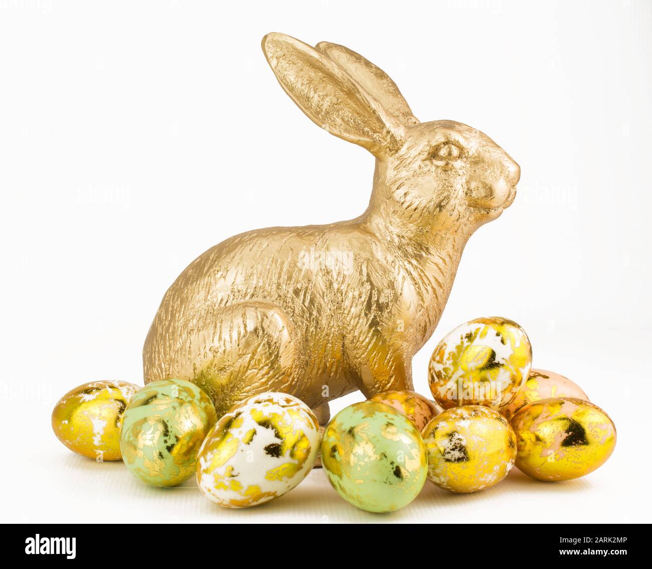 gold rabbit with red rose on white background Stock Photo - Alamy