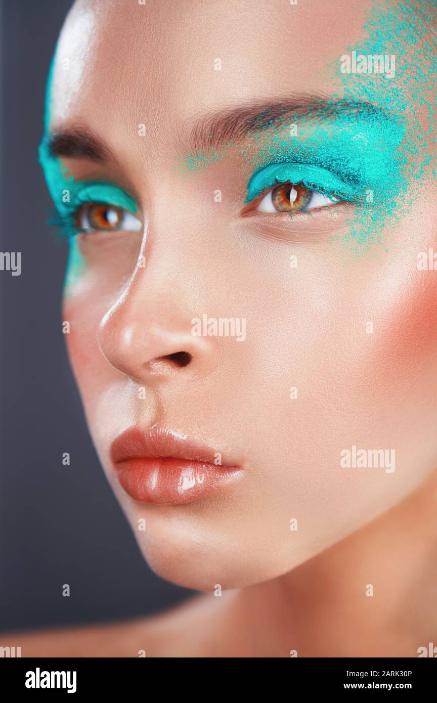 Woman with fashion makeup and green eye shadows. Fashion makeup Stock Photo