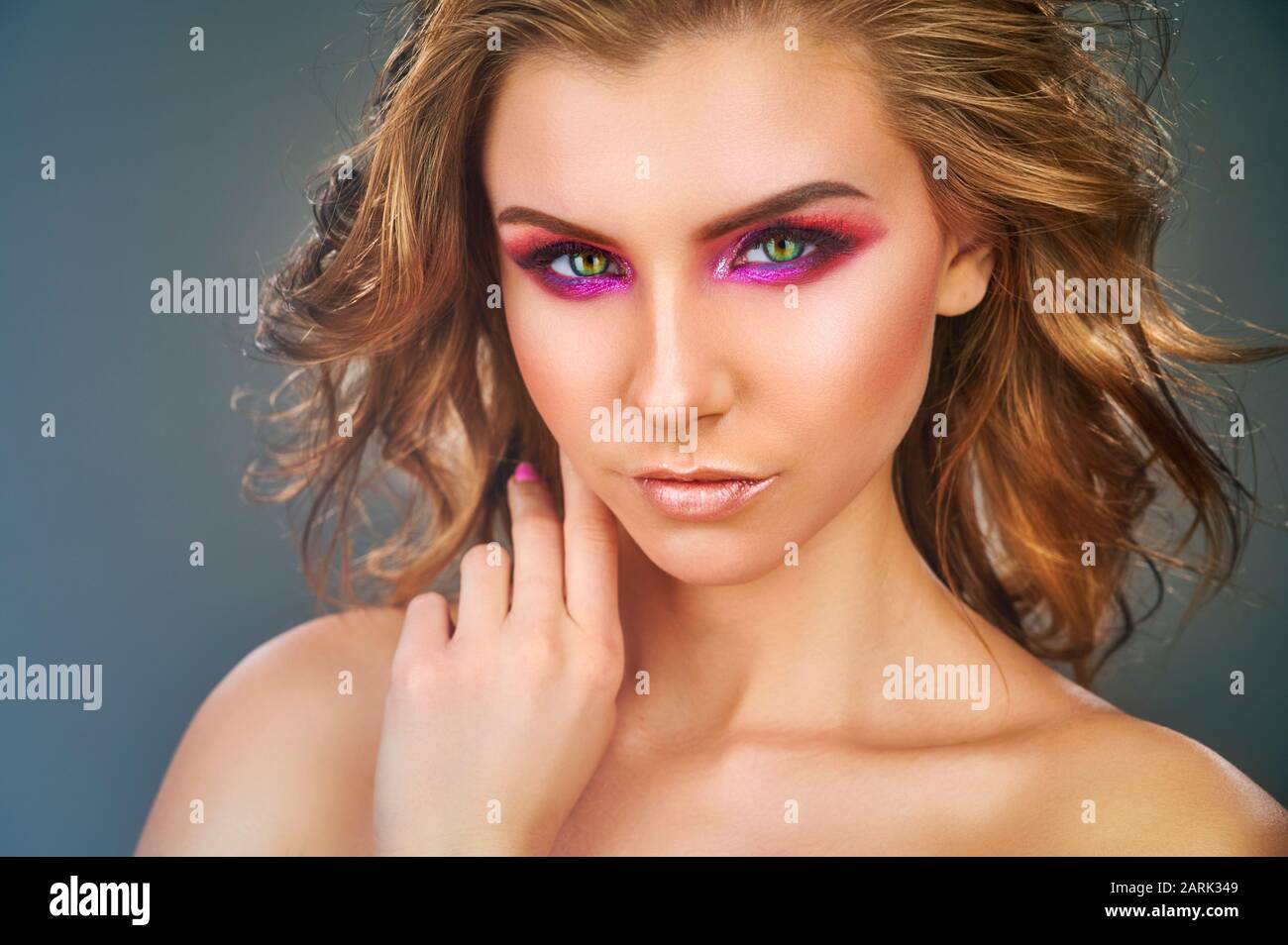 Fashion makeup. Beauty fashion model girl. Beautiful model girl with pink fuchsia makeup Stock Photo