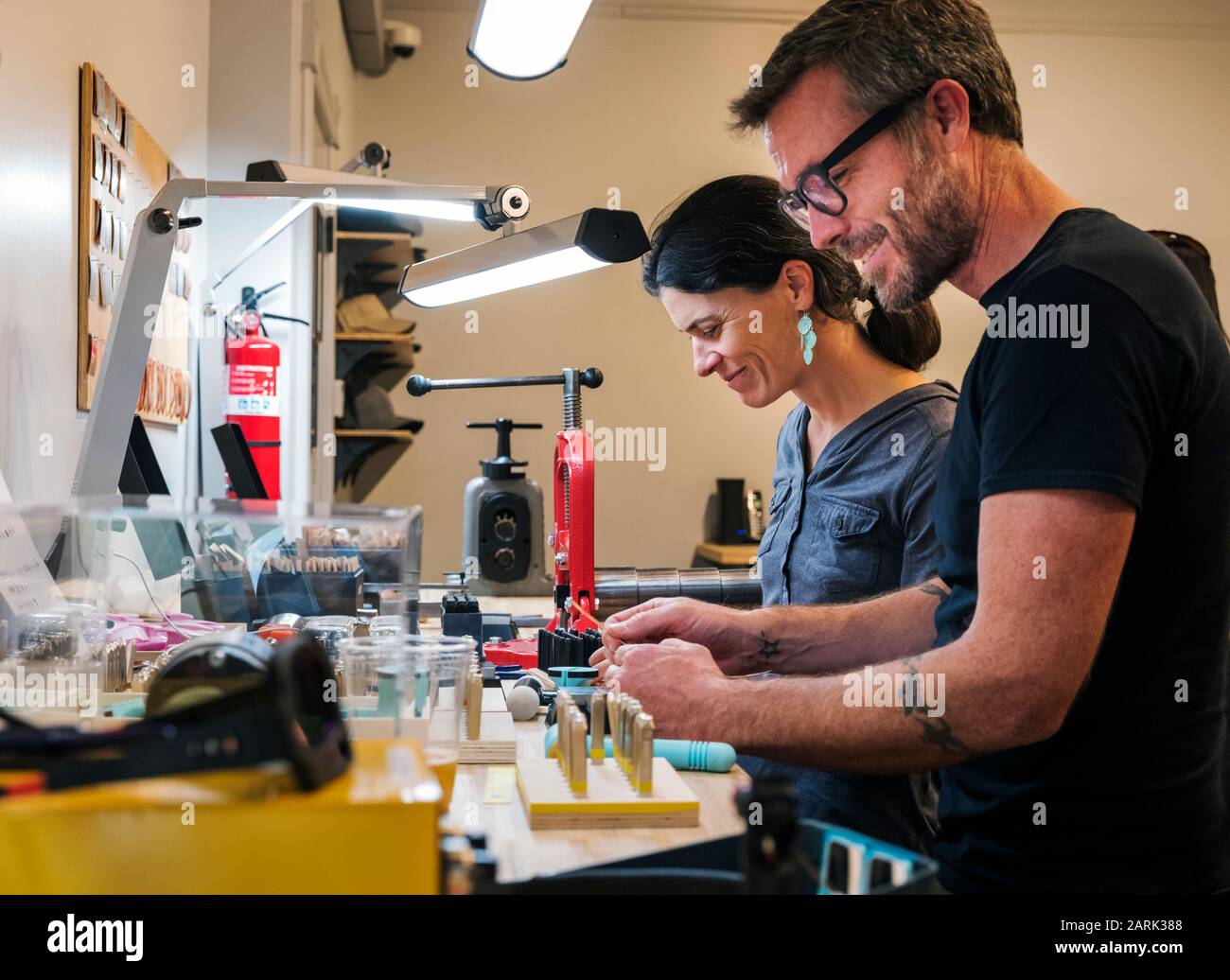 Customers learn to craft jewelry; Riveting Experience Jewelry; Salida; Colorado; USA Stock Photo