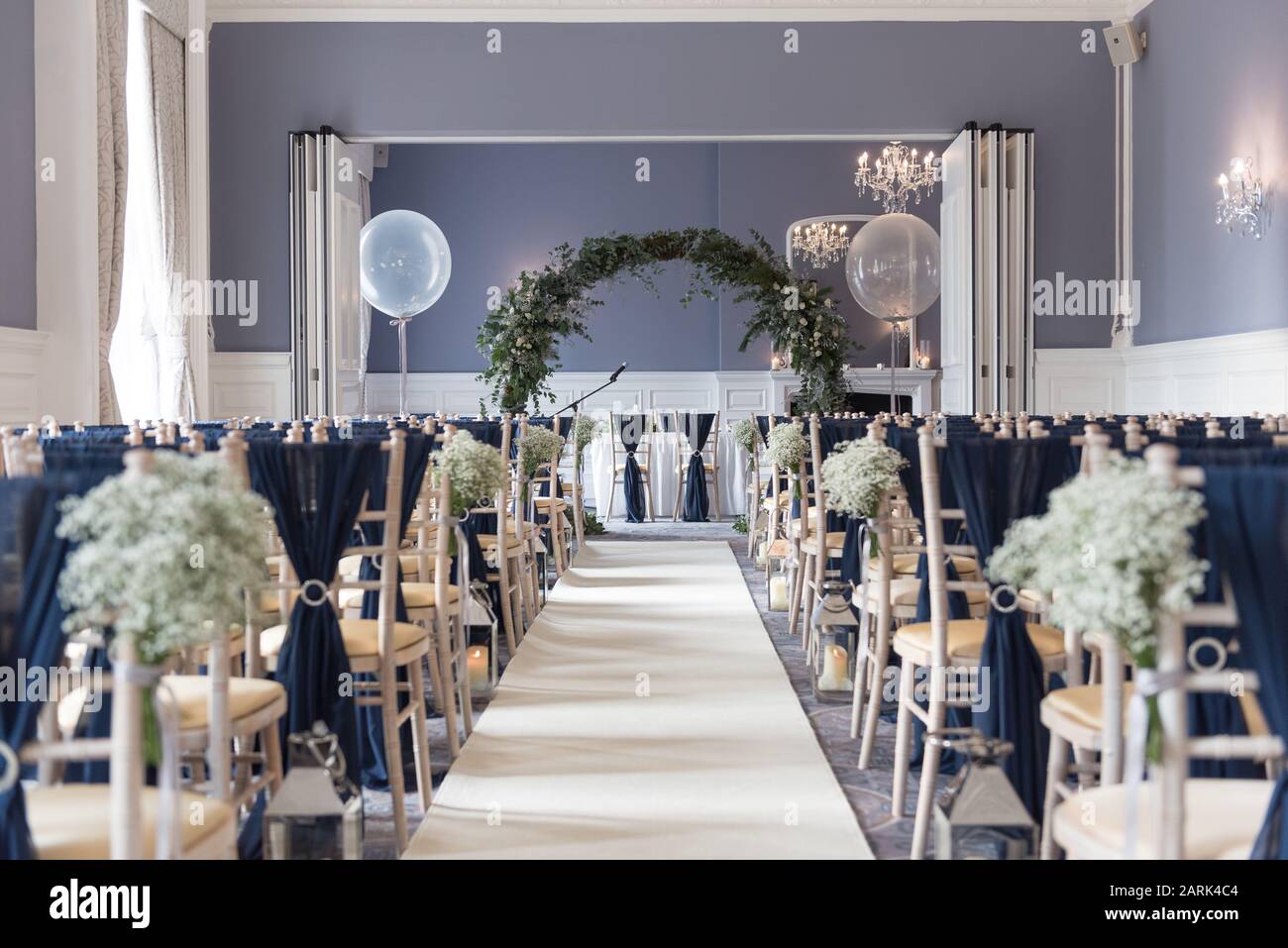ceremony room for weddings with flowers and dark blue dressings Stock Photo