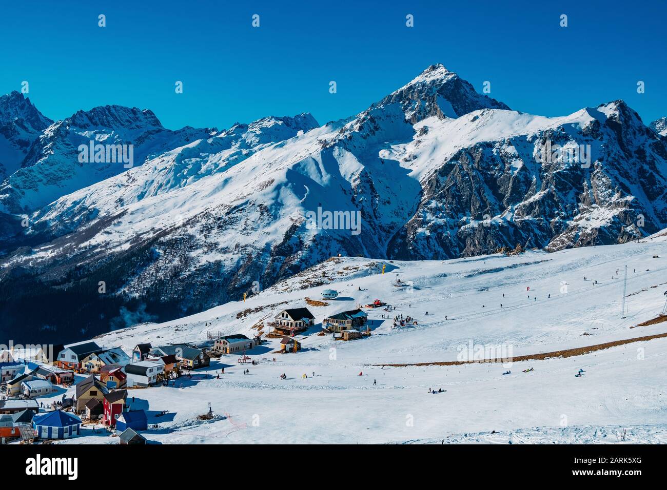 Downhill skiing resort in high mountains. Ski slope Stock Photo
