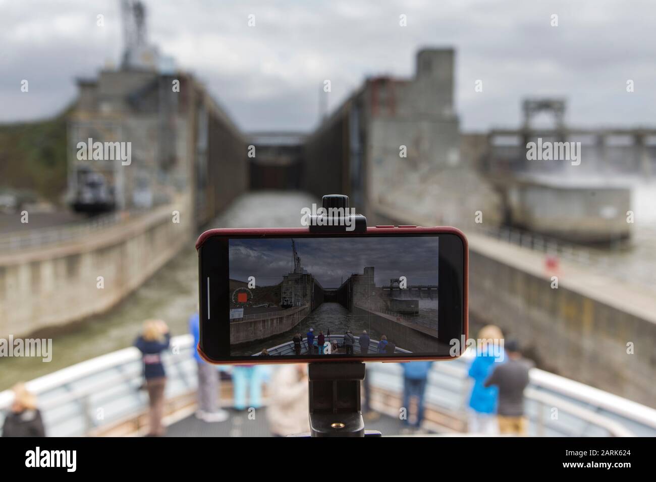 A cell phone records a timelapse of a ship going through a lock. Stock Photo