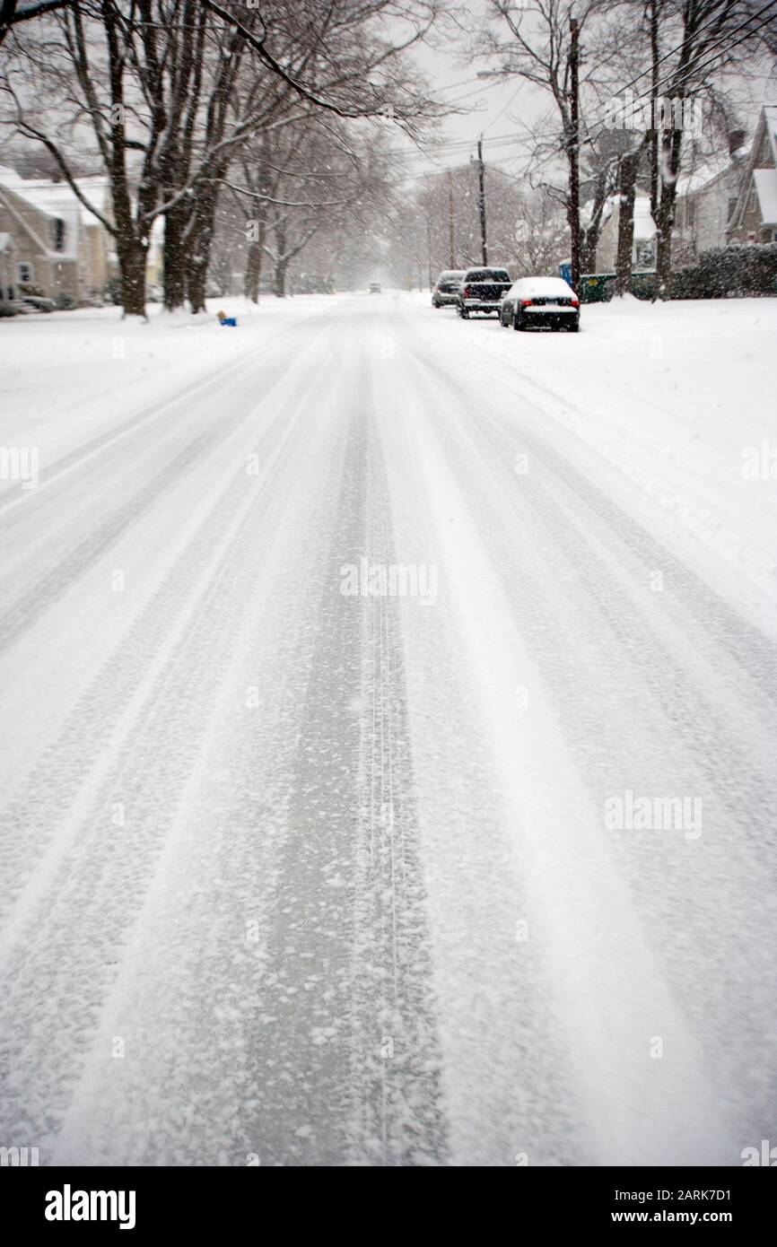 Winter blizzard covers a deserted suburban street Stock Photo - Alamy