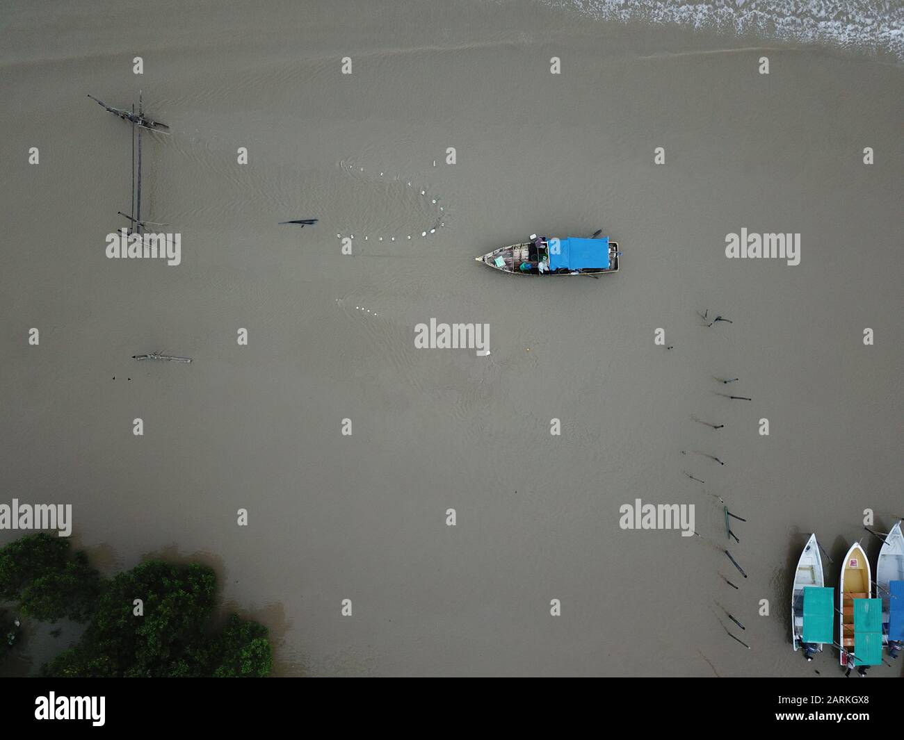 A top down view of a group of fishing vessels or boats in a port or ...