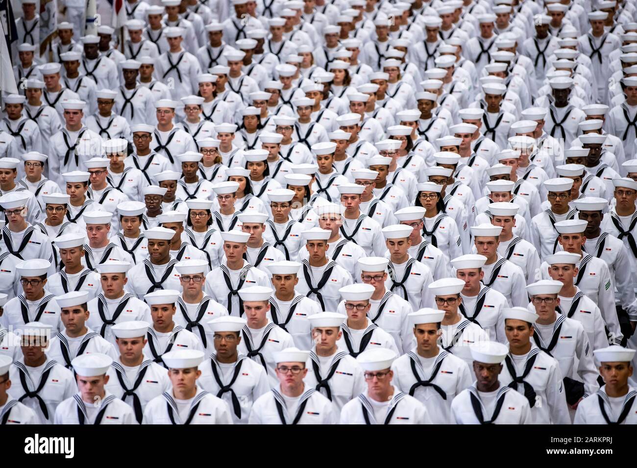 190906-N-PL946-1098 GREAT LAKES, Ill. (Sept. 6, 2019) Graduating recruits stand in formation inside Midway Ceremonial Drill Hall during a pass in review graduation ceremony at Recruit Training Command. More than 35,000 recruits train annually at the Navy's only boot camp. (U.S. Navy photo by Mass Communication Specialist 1st Class Spencer Fling/Released) Stock Photo