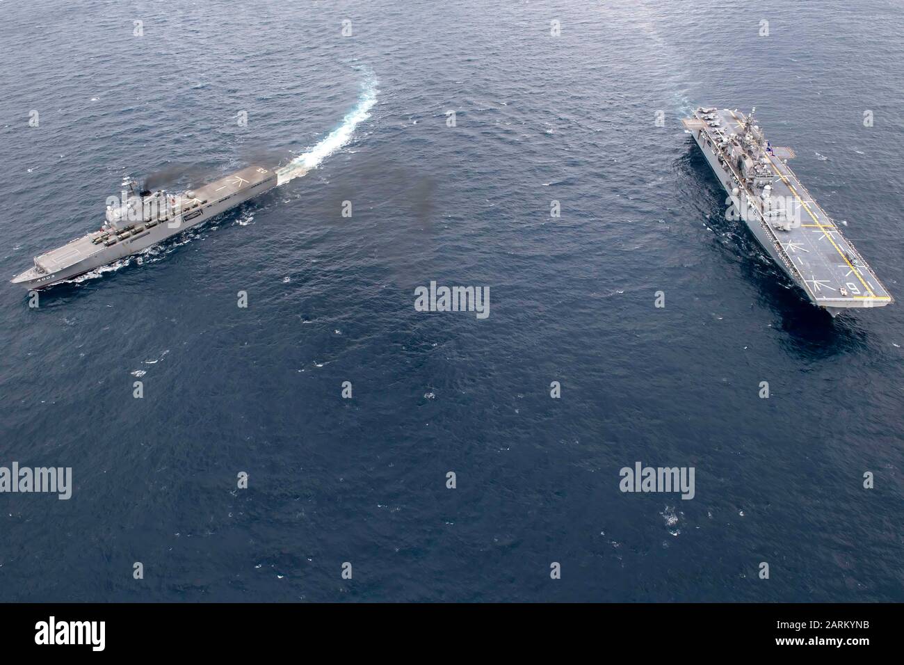 200113-N-RU810-1140EAST CHINA SEA (Jan. 13, 2020) The amphibious assault ship USS America (LHA 6), right, and the Japan Maritime Self-Defense Force amphibious transport dock ship JS Kunisaki (LST 4003) operate together in the East China Sea. The America Expeditionary Strike Group, 31st Marine Expeditionary Unit team is operating in the U.S. 7th Fleet area of operations to enhance interoperability with allies and partners and serve as a ready response force to defend peace and stability in the Indo-Pacific region. (U.S. Navy photo by Mass Communication Specialist 3rd Class Vincent E. Zline/Rele Stock Photo