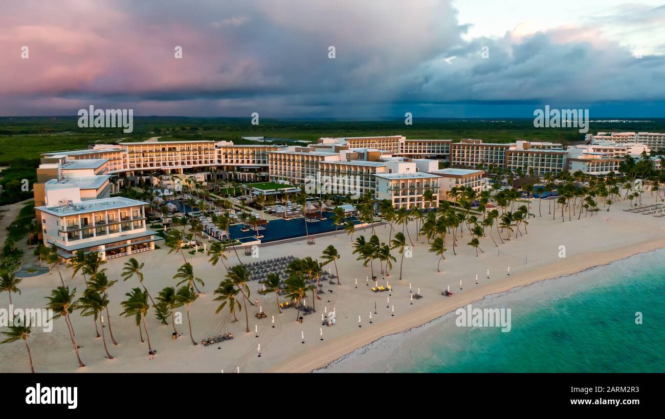 Luxury beach resort at sunset, aerial view of tropical seaside and