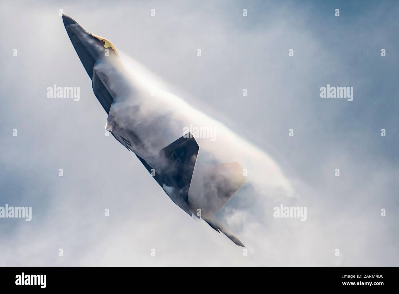 U.S. Air Force Maj. Paul Lopez, F-22 Demo Team commander, performs the power loop maneuver during the Spirit of St. Louis Air Show Sept. 7-8, 2019. Utilizing the thrust vectoring technology of the world's premier 5th-generation fighter, the power loop showcases the Raptor's ability to perform a complete backwards rotation through the air while remaining completely stationary. (U.S. Air Force photo by 2nd Lt. Sam Eckholm) Stock Photo