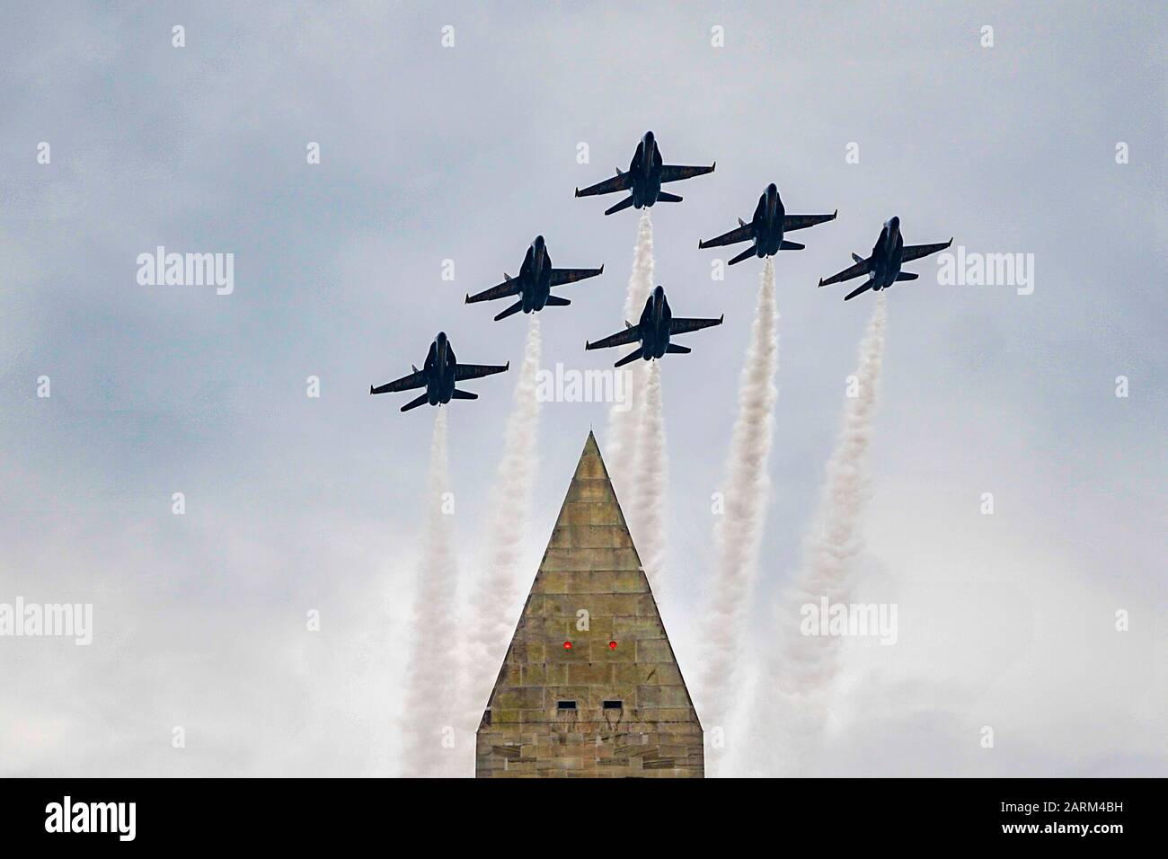 190704-N-IR734-1024 WASHINGTON (July 4, 2019) The U.S. Navy flight demonstration squadron, the Blue Angels, fly over the Washington Monument during a Fourth of July celebration in Washington, D.C., July 4, 2019. The team is scheduled to conduct 61 flight demonstrations at 32 locations across the United States and Canada in 2019. (U.S. Navy photo by Mass Communication Specialist 1st Class Ian Cotter/Released) Stock Photo
