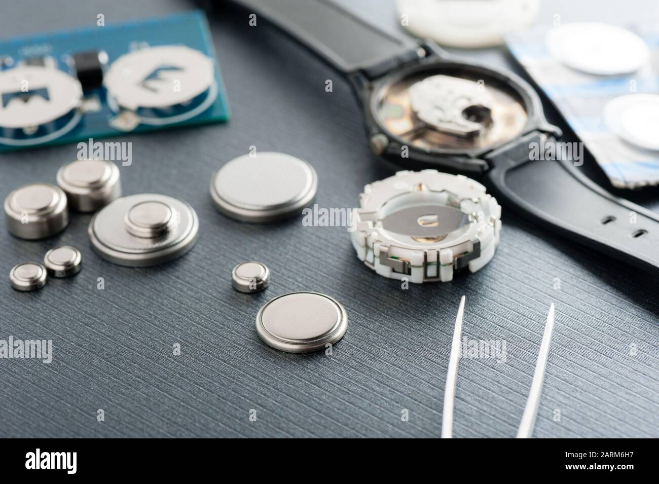 closeup button cell battery or watch battery or coin cell, used to power small electronics devices such as wrist watches or computer motherboard. Stock Photo