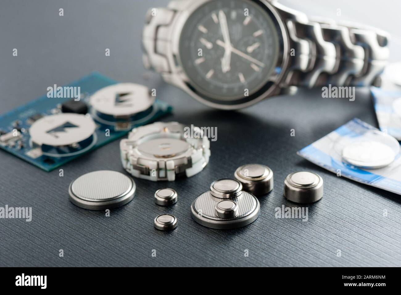 closeup button cell battery or watch battery or coin cell, used to