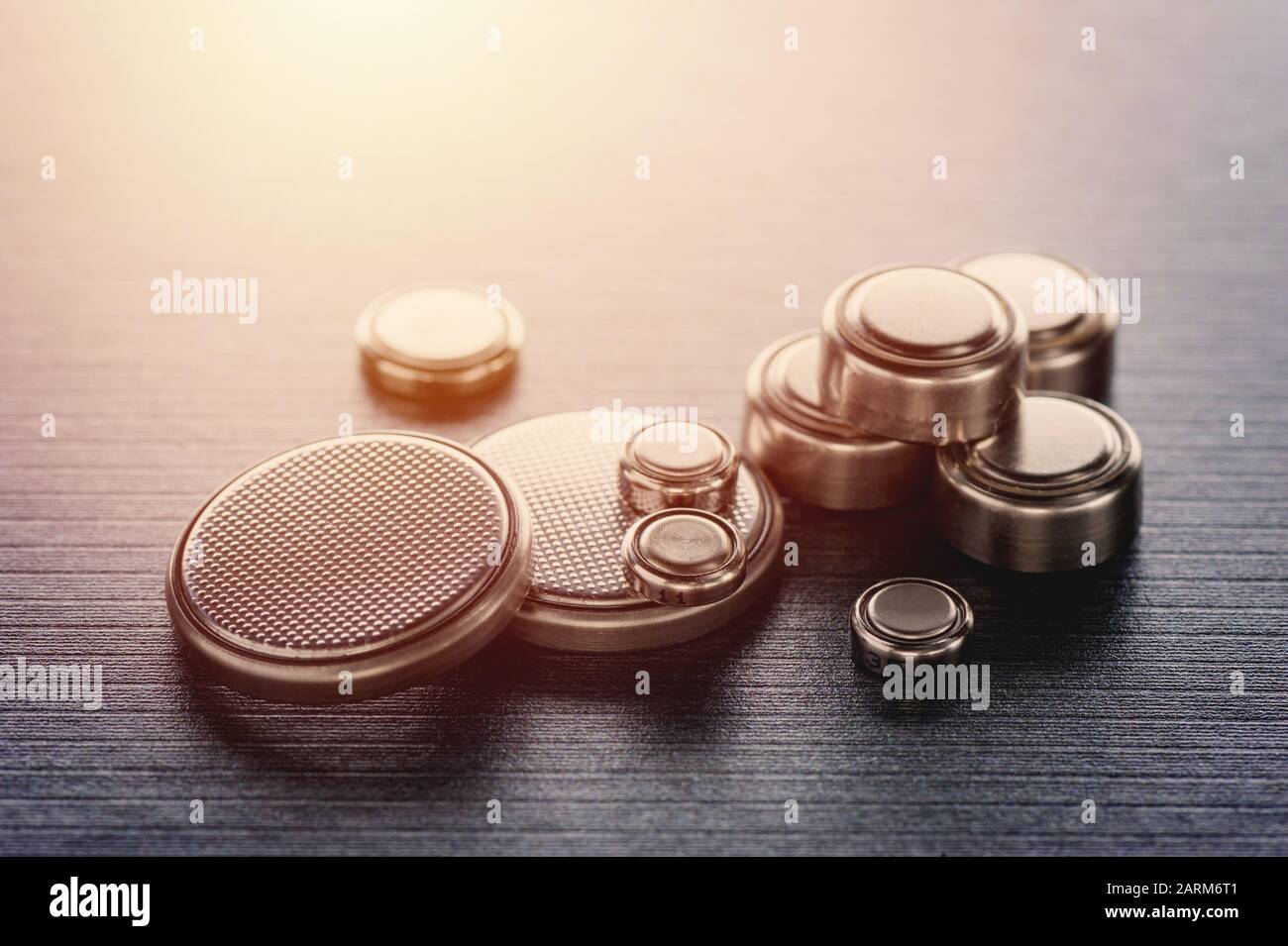 closeup button cell battery or watch battery or coin cell, used to power small electronics devices such as wrist watches or computer motherboard. Stock Photo