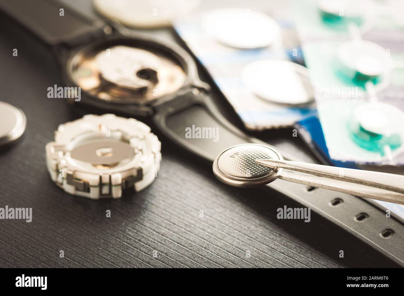 closeup button cell battery or watch battery or coin cell, used to power small electronics devices such as wrist watches or computer motherboard. Stock Photo