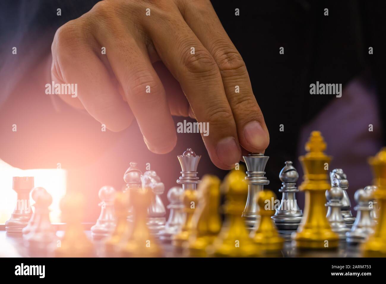 Chess game on chess board behind business man background. Business concept  to present financial information and marketing strategy analysis. Investmen  Stock Photo - Alamy