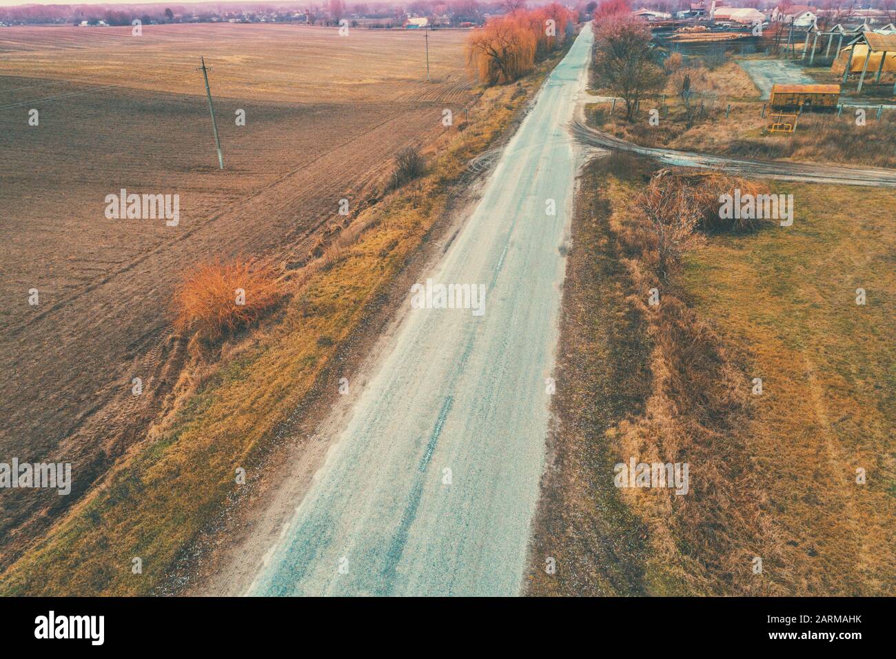 Aerial view of countryside and straight country road. Farmland in autumn Stock Photo
