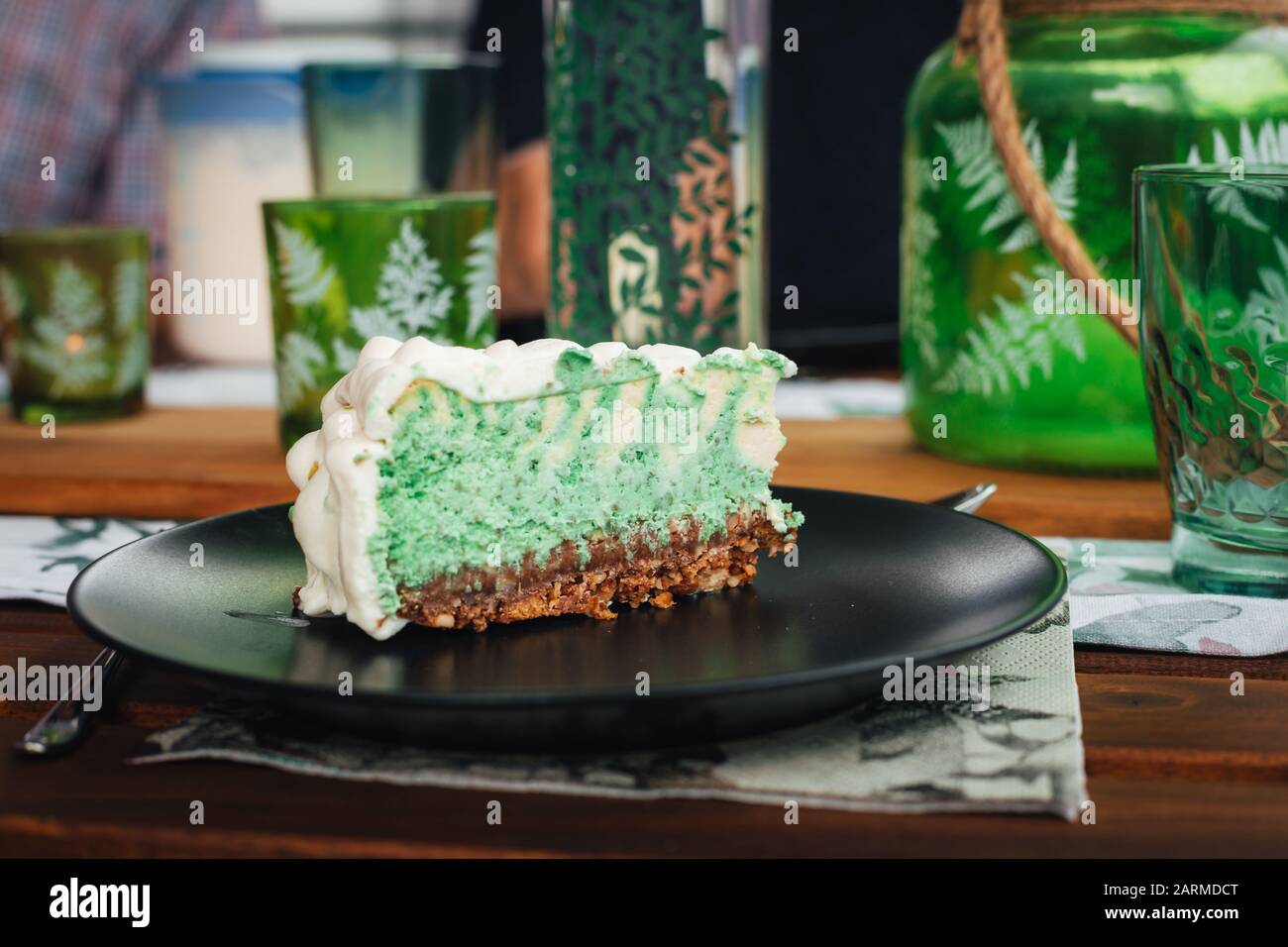 Slice Of A Home Made Acid Green Mint Cheese Cake With Zebra Pattern On A Black Plate Stock Photo Alamy