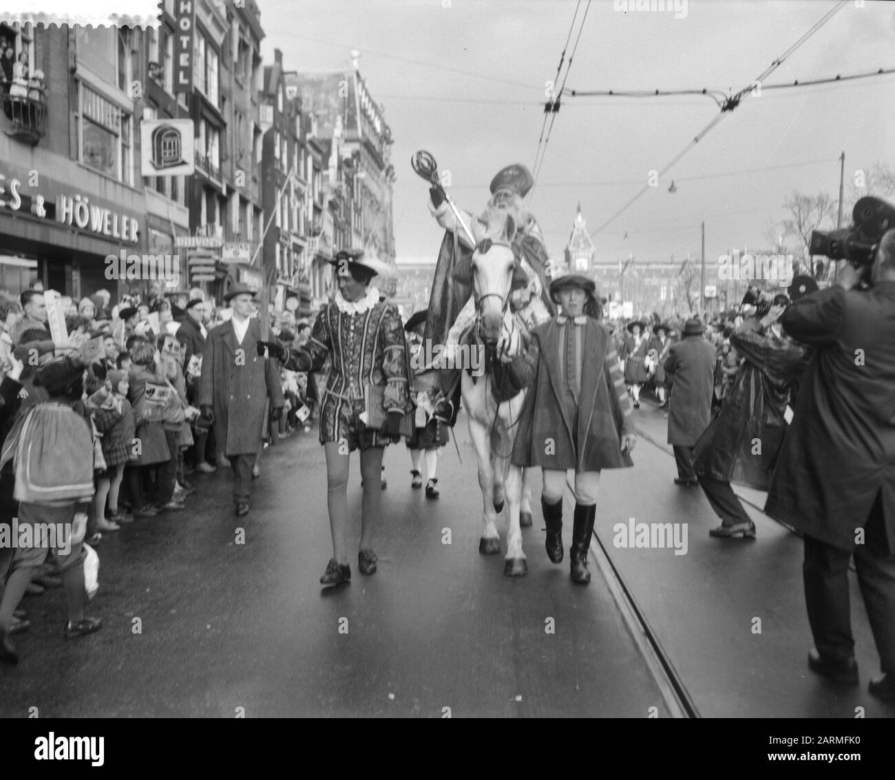 Entry St. Nicholas in Amsterdam, St. Nicholas time entry on the Damrak Date: 19 November 1960 Location: Amsterdam, Noord-Holland Keywords: Entractions Personal name: Sinterklaas Stock Photo