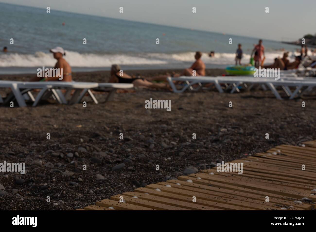 beach parasol, woman laying, tourism travel, dry grass, alushta crimea, senior couple, seaside resort Stock Photo