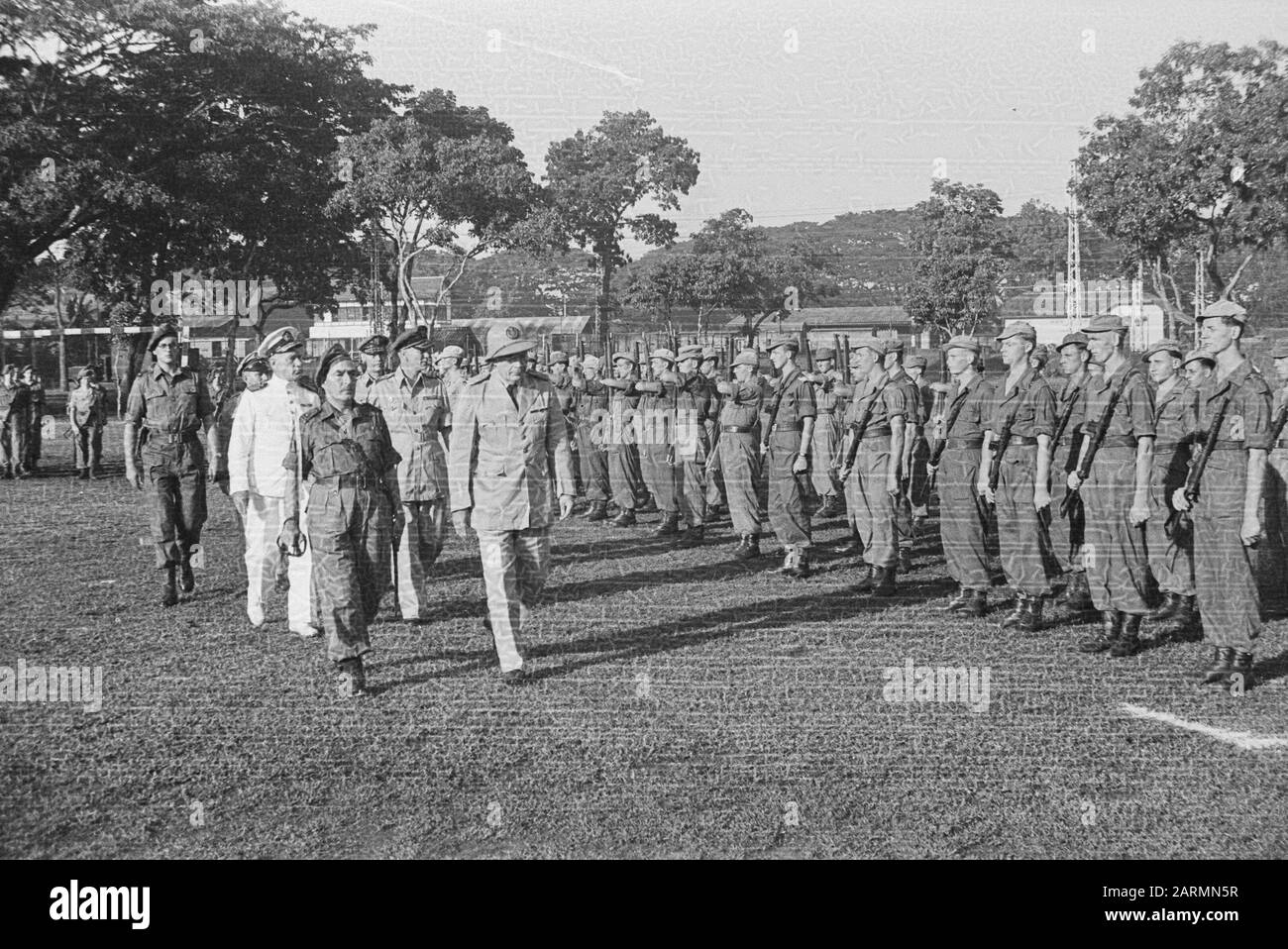 Second centenary of Mineurs and Sappeurs of the Genie  Celebration 2nd centenary by the Genie in Tjilitjan. [Lieutenant Governor General Van Mook inspects the troops. Behind him Deputy Admiral Pinke and General Buurman van Vreeden] Date: May 15, 1948 Location: Batavia, Indonesia, Jakarta, Dutch East Indies Stock Photo