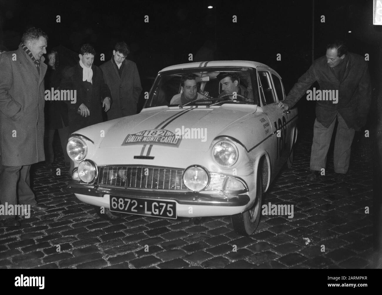 French: Roger Rivière and Raphaël Géminiani in their racing car engaged in the 1962 Monte Carlo Rally; Stock Photo