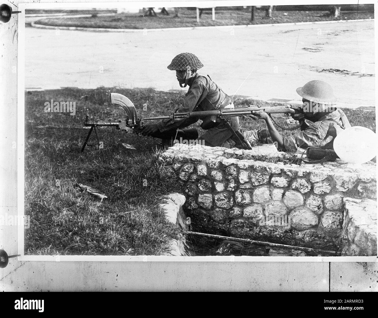 Dutch soldiers with weapons. Madsen carabiner machine gun of the KNIL