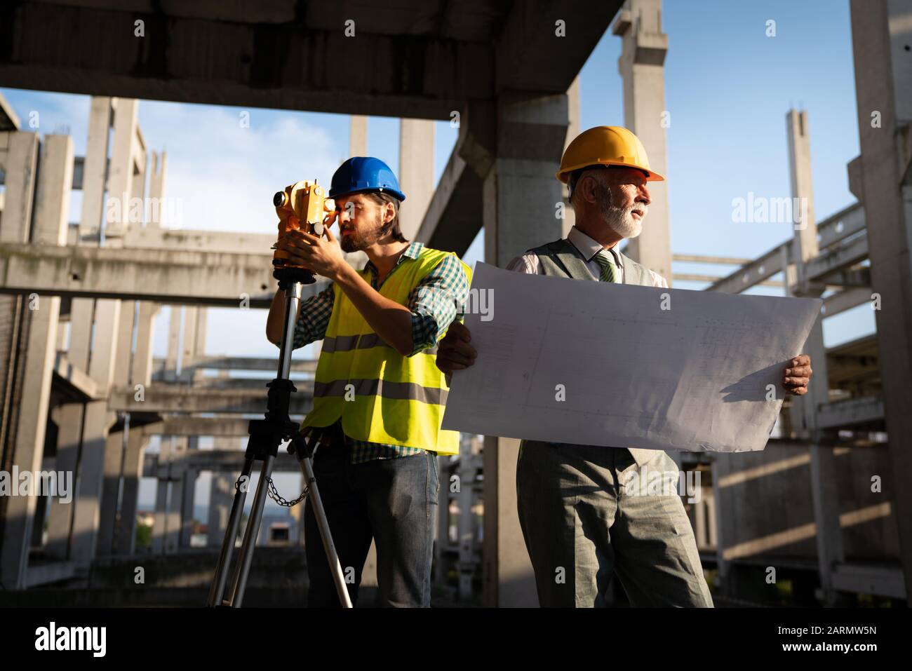 Picture of construction site engineer looking at blueprint Stock Photo ...