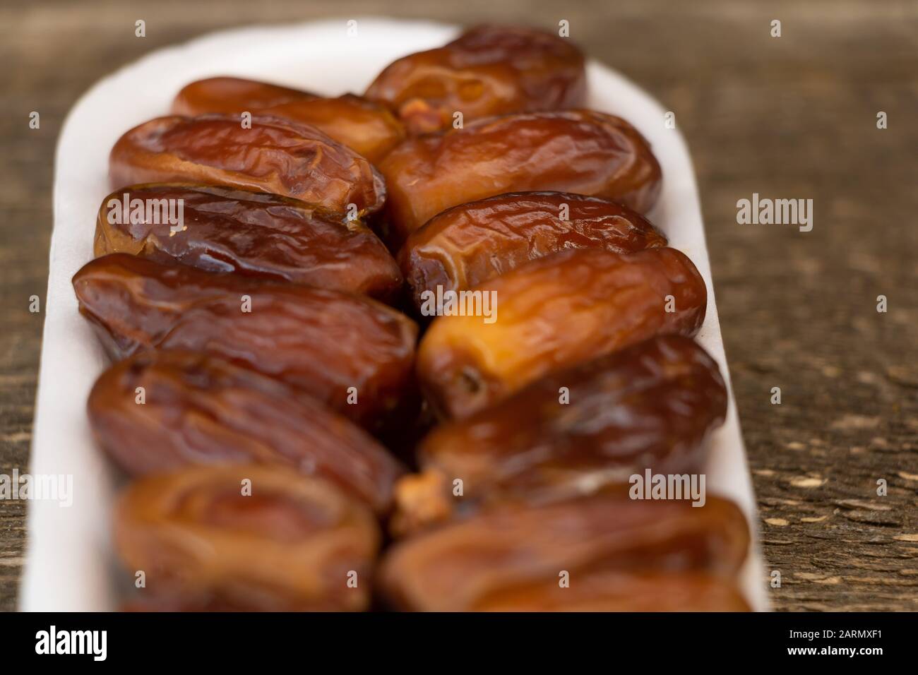 Benefits of Dates. Dried Dates on wooden background Stock Photo Alamy
