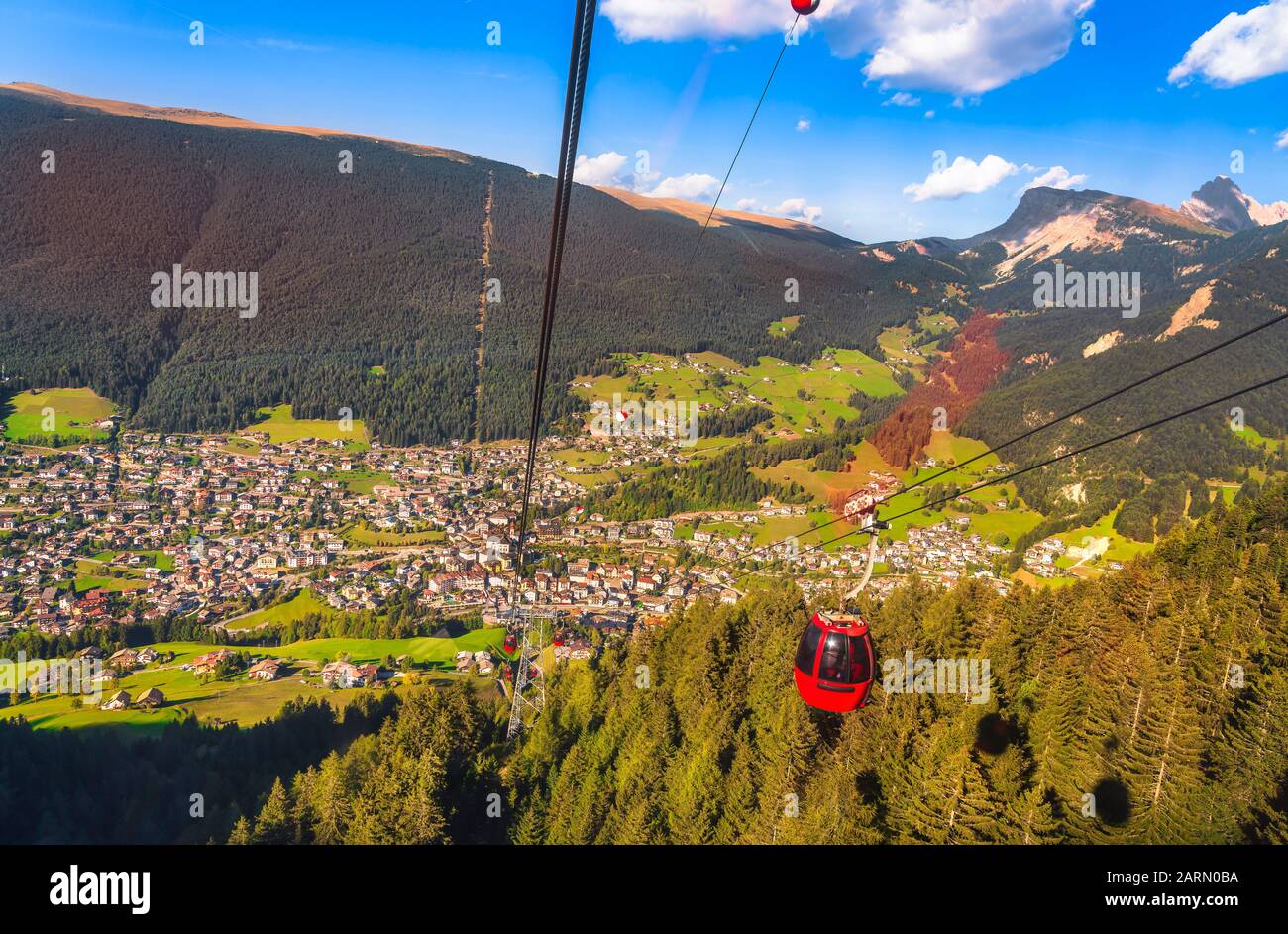 Aerial view of Ortisei or St Ulrich mountain village from Seuc mount cableway. Dolomites, South Tyrol, Italy. Europe. Stock Photo