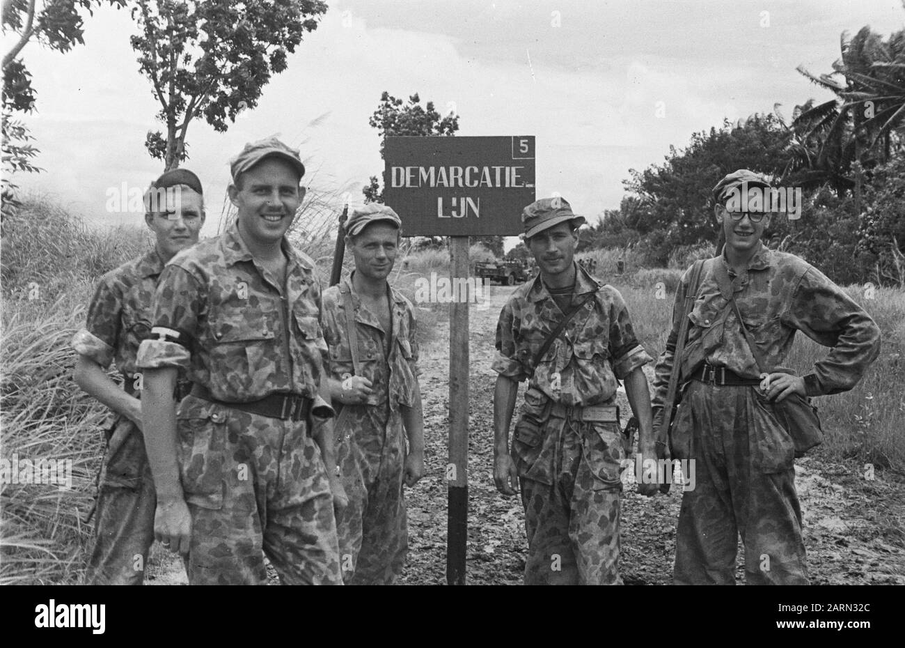 Reportage Semarang and surroundings  Five soldiers at the sign demarcation line (5) Date: 1947/01/01 Location: Indonesia, Java, Dutch East Indies, Semarang Stock Photo