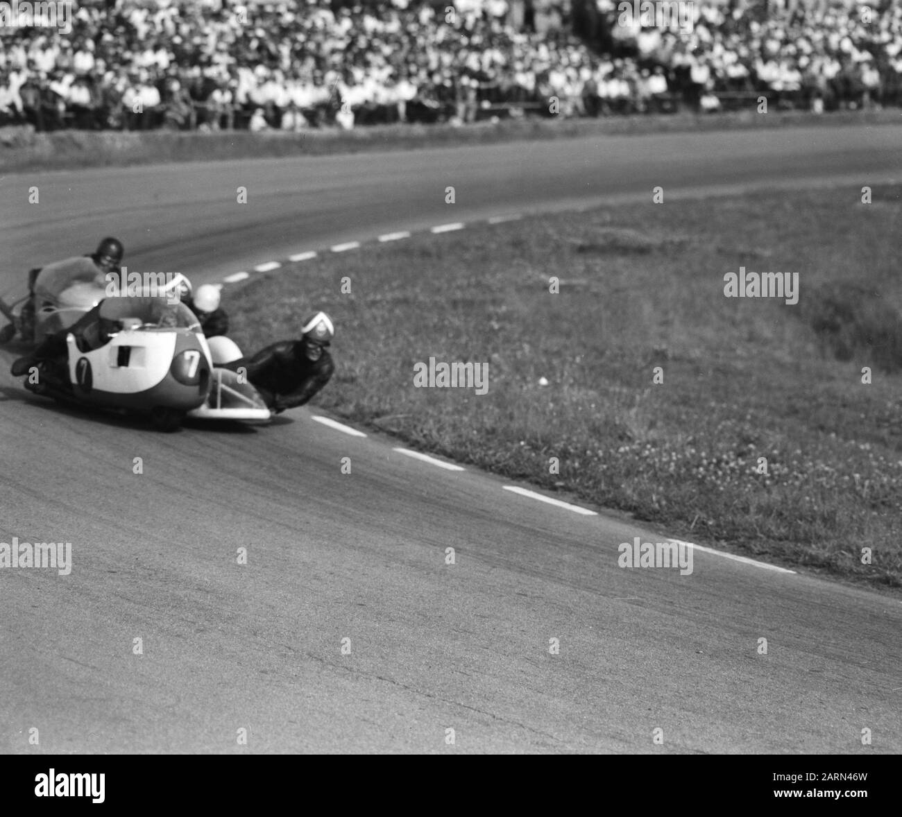 TT Assen 1964  Side race. Front nr. 7 Floran Camathius with in the sidecar Alfred Herzig on Gilera Annotation: The original bakesist Ronald Föll was fatally killed at the training Date: 27 June 1964 Location: Assen Keywords: Motorsport Personname: Camathias, Fl., Herzig, Alfred Institution name: TT Stock Photo