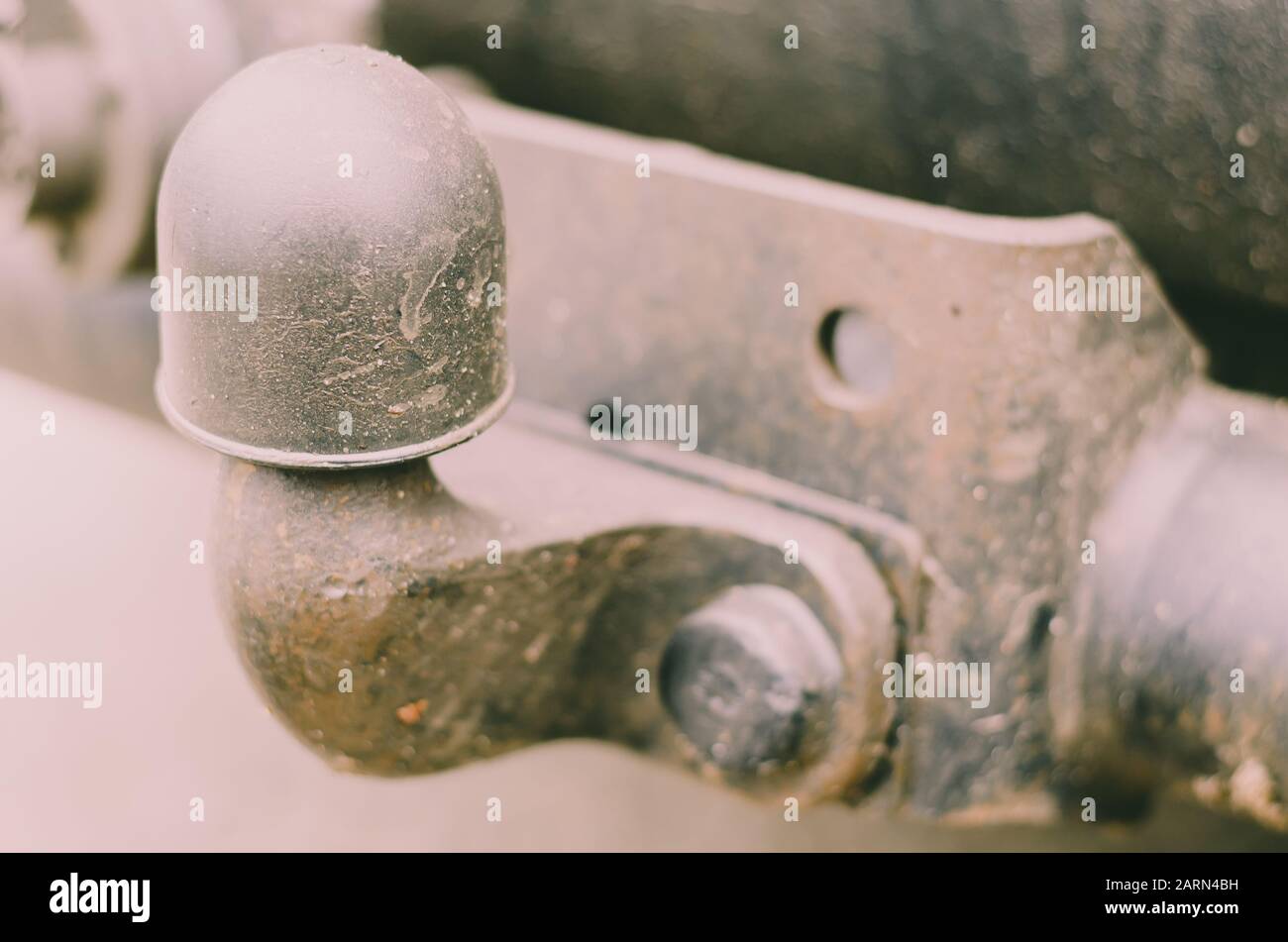 Old Tow Hitch for towing a trailer. A dirty rusty trailer hitch is