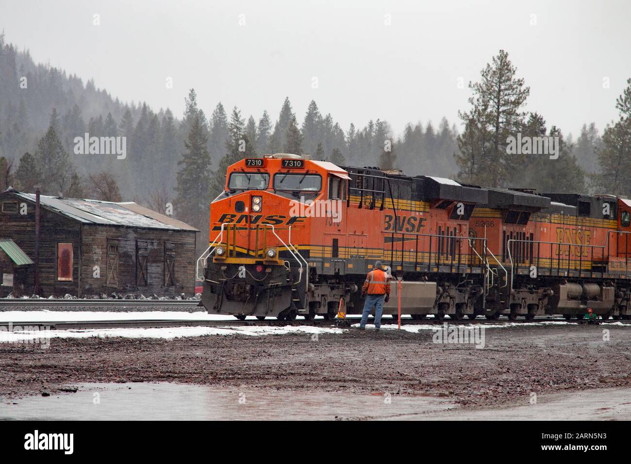 A Burlington Northern BNSF Railroad switchman on the tracks in the town