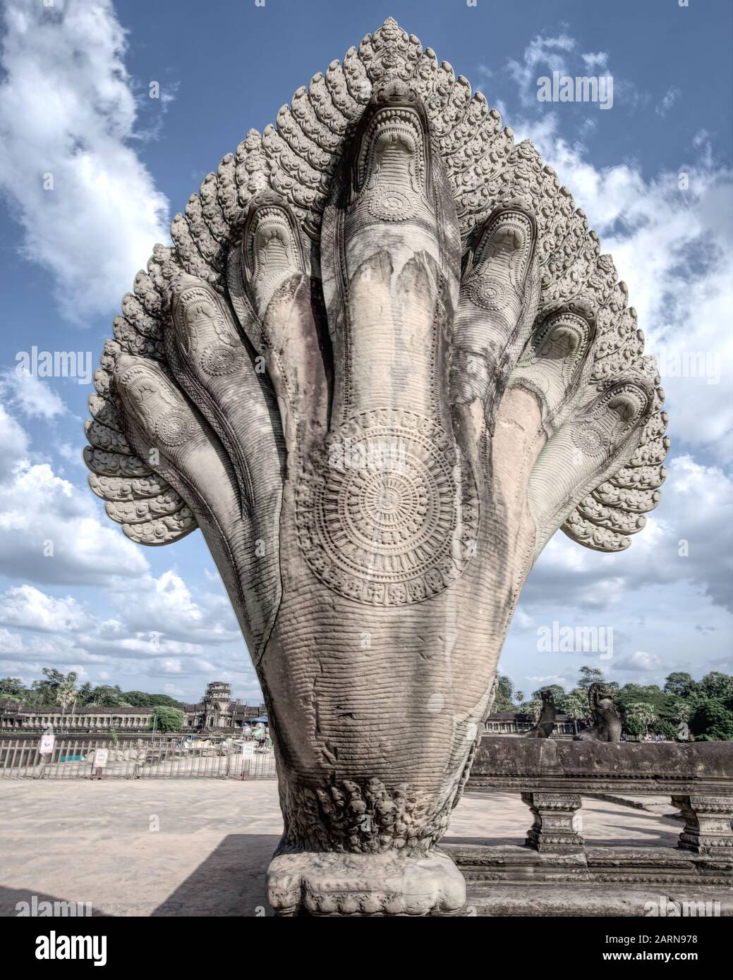 At the access to the great temple of Angkor Wat there is the statue of the mythical Naga, the seven-headed serpent protector of Buddha Stock Photo
